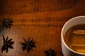Detail of a cup of tea and some star anise.