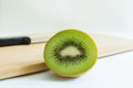 Detail of a cut fresh kiwis on white background