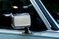 Detail of a cyan colored vintage car rearview mirror