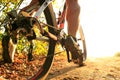 Detail of cyclist man feet riding mountain bike on outdoor