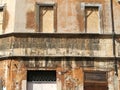 Detail of a damaged  building in the historical center of Rome in Italy. Royalty Free Stock Photo