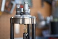 Detail of the decapping and resizing process of a 9mm case in the reloading press. Royalty Free Stock Photo