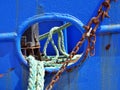 Detail of the deck of a fishing boat docked at the port with ropes