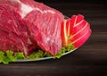 Detail of decorated fresh raw meat - ham with vegetables Royalty Free Stock Photo