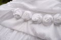 Detail of decorating white wedding dresses for the bride Royalty Free Stock Photo