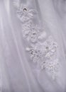 Detail of decorating white wedding dresses for the bride Royalty Free Stock Photo