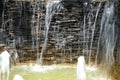 Detail of a decorative waterfall in the garden. Royalty Free Stock Photo