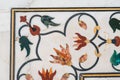 Floral design of precious stones on the marble walls of Taj Mahal monument, India