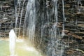 Detail of a decorative waterfall in the garden. Royalty Free Stock Photo