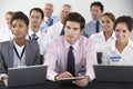 Detail Of Delegates Listening To Presentation At Conference