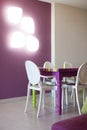 Detail of dinning room with colourful table and chairs Royalty Free Stock Photo