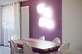 Detail of dinning room with colourful table and chairs Royalty Free Stock Photo