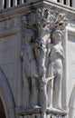 Detail of the Doge Palace with statues of Adam and Eve, St. Mark Square, Venice Royalty Free Stock Photo