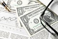 Detail of dollars near glasses and golden pen Royalty Free Stock Photo