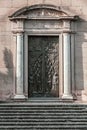 Detail of the door with columns and bas-relief. Viterbo Cathedral. Italian: Duomo di Viterbo.