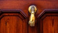 detail of door knocker on brown door. Menorca, Balearic Islands, Spain