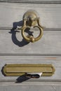 Detail of the door knocker and letter box Royalty Free Stock Photo