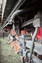 Detail of the drive wheels, connecting rods and running gear of old steam locomotive FS940 recently restored. Royalty Free Stock Photo