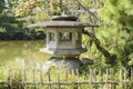 Detail of east garden with stone lantern and pond of Heian Jiungu Shrine in Kyoto, Japan. Royalty Free Stock Photo
