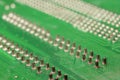 Detail electronic parts on a green PCB