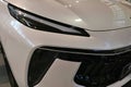 Detail of elegant front mask with sleek LED headlights of SUV car DongFeng (Forthing) T5 EVO