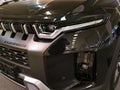 Detail of elegant sleek multi segment LED headlight on mid-sized korean SUV crossover KG Mobility Torres