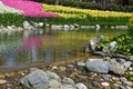 Detail in Emirgan Park, little lake and colorful flowers in background