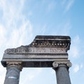 Detail of the entrance door of the ancient Greco-Roman amphitheater in Catania, on a background with blue sky Royalty Free Stock Photo