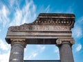 Detail of the entrance door of the ancient Greco-Roman amphitheater in Catania, on a background with blue sky Royalty Free Stock Photo