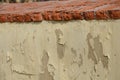 Detail of erosion of the roof of the crown of the wall, the fence of the garden. poorly fired bricks succumbed to erosion. water a