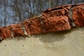 Detail of erosion of the roof of the crown of the wall, the fence of the garden. poorly fired bricks succumbed to erosion. water a