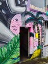 Colourful Graffiti Around Open Door