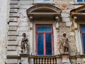 Detail of Old Stone House With Statues Beside Window, Bucharest, Romania Royalty Free Stock Photo