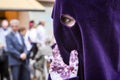 Detail of eye of penitence during a Holy week procession Royalty Free Stock Photo