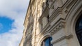 Detail of facade building in Europe under blue sky with cloud. Royalty Free Stock Photo