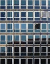 Detail of the facade of a modern building with regular symetric rectangular windows