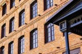 Detail of the facade of a modern loft-style office building, rebuilt from an old steam mill