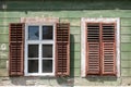 Detail of facade with old windows in rustic ancient house in Sibiu city,  Romania Royalty Free Stock Photo