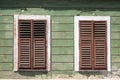 Detail of facade with old windows in rustic ancient house in Sibiu city,  Romania Royalty Free Stock Photo