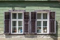 Detail of facade with old windows in rustic ancient house in Sibiu city,  Romania Royalty Free Stock Photo