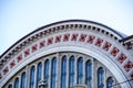 Detail of the facade of semi-circular wall with empty arched windows without glass. Ancient building.