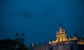 Detail of facade on the top of arcades at rynek glowny or main city square in Krakov at night