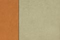 Detail facade two-tone plaster in beige and orange with black vertical dividing line in different divisions