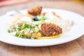 detail of falafel in white dish with mezze or selection of typical Arabic appetizers