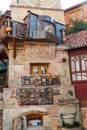 Detail of falling Clock tower of puppet theater Rezo Gabriadze in old town of Tbilisi, Georgia