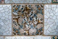 Detail of the famous broken tiles (trencadis) in the Park Guell, Barcelona, Spain.