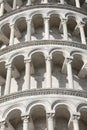 Detail of Leaning Tower of Pisa with white arches and columns in Royalty Free Stock Photo