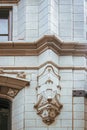 Detail of feature on outside of Art Deco building in Tulsa Oklahoma with ridges and door nearby