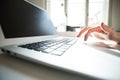 Detail of a female hand on the keyboard