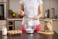 Woman measuring flour